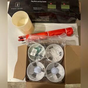 new PGA flag and cup set plus new sealed 4 cups with balls, marker and tees.